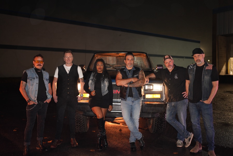 Lights Above the Mesa, six members in front of a pickup truck at night.